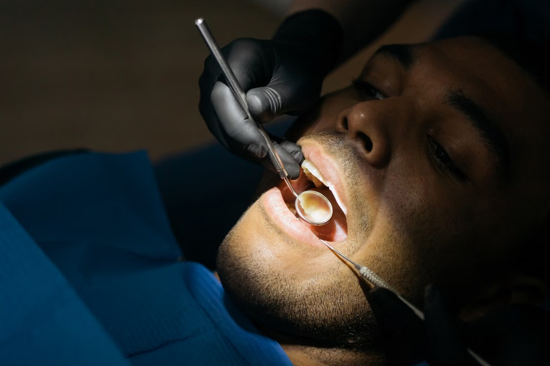 a man getting a dental checkup.